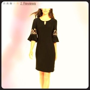 Black dress.  Embroidered embellishments.